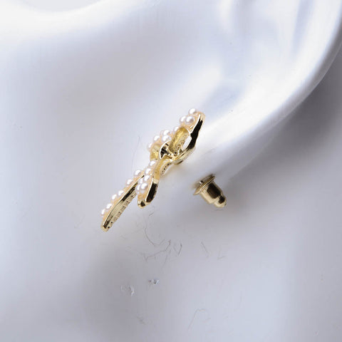 Golden papion ring stud with pearl for women's accessories by Bentati Fashion Dubai