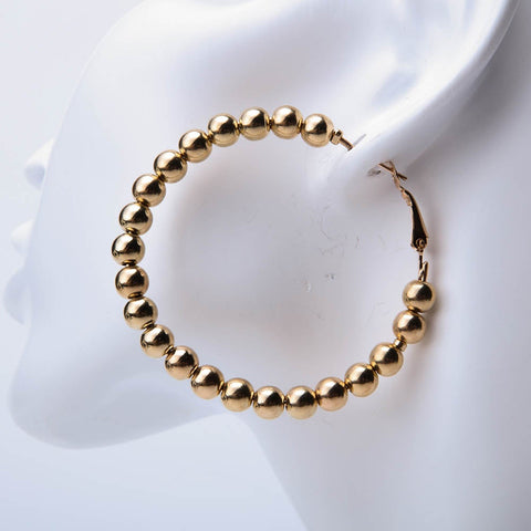 Golden round shaped beaded earrings for women's accessories by Bentati Fashion Dubai