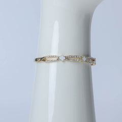 Golden bangle with crystal stones for women's accessories by Bentati Fashion Dubai