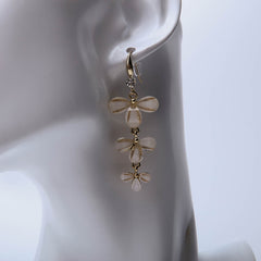 Golden three layer flower drop earrings for women's accessories by Bentati Fashion Dubai
