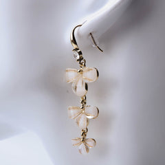 Golden three layer flower drop earrings for women's accessories by Bentati Fashion Dubai