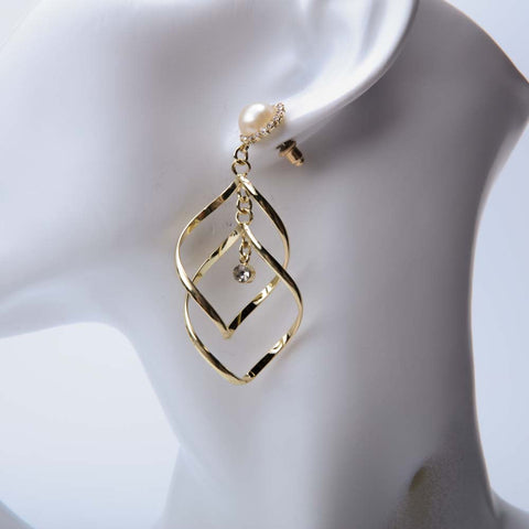 Golden twist hoop earrings for women's accessories by Bentati Fashion Dubai