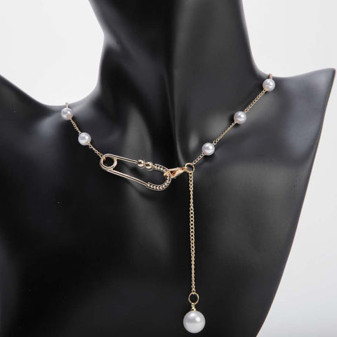 White pearl pendant necklace with golden chain and crystal safetypin for women's accessories by Bentati Fashion Dubai